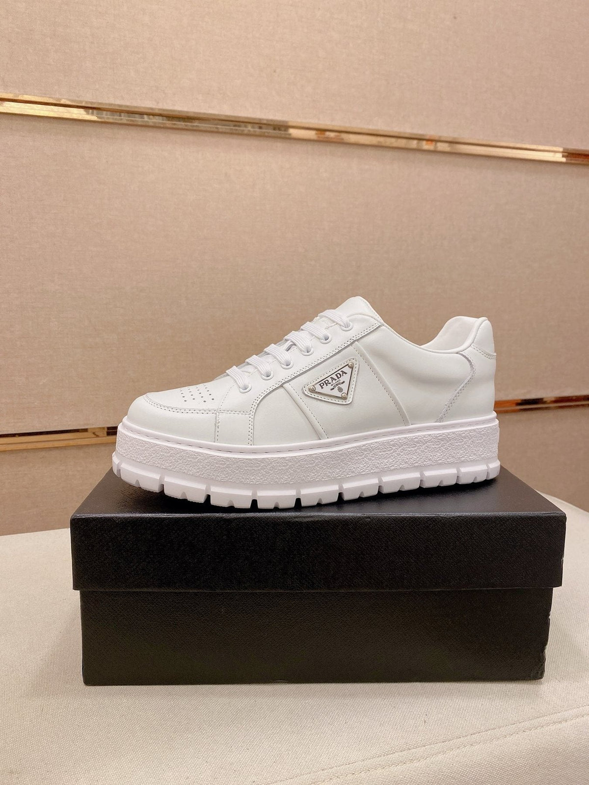 Prada Triangle Plaque Low-Top Sneakers — front