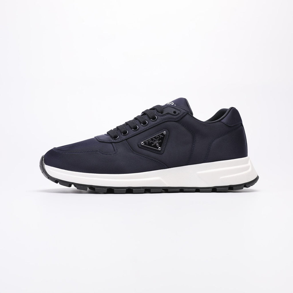 PRADA Navy Triangle Badge Sneakers — front