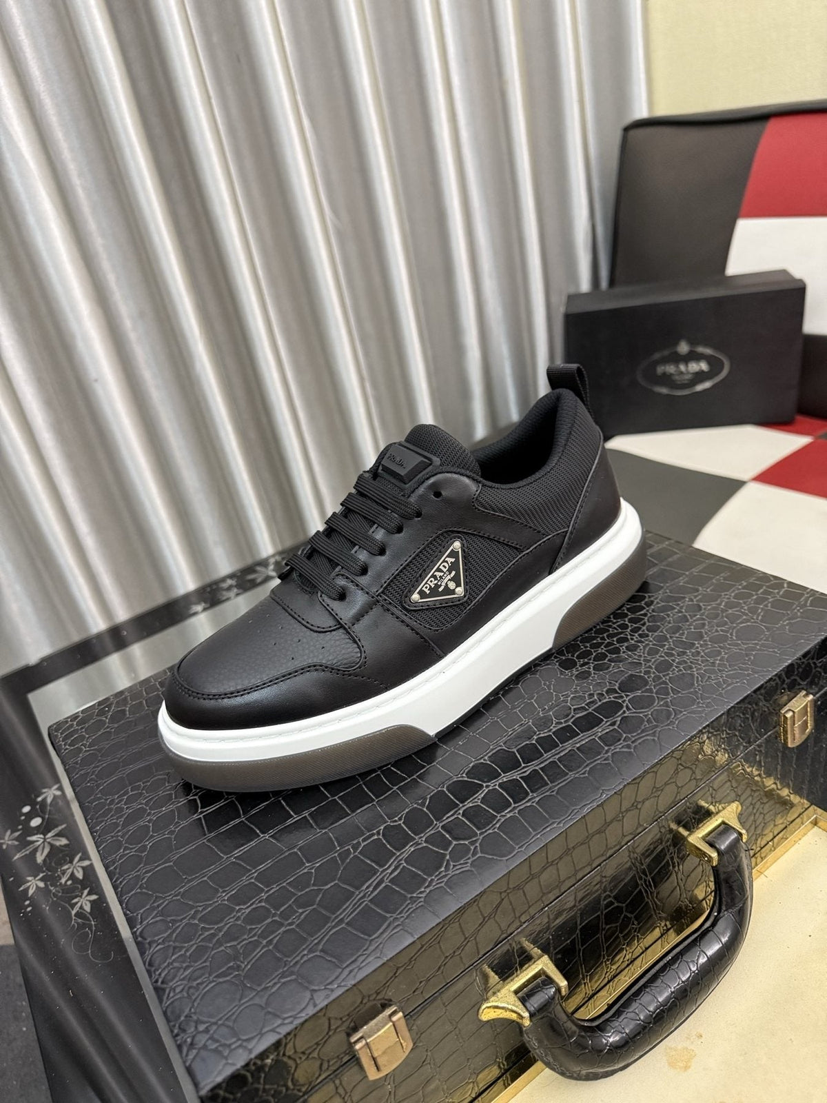 Prada Triangle Plaque Low-Top Sneakers — front